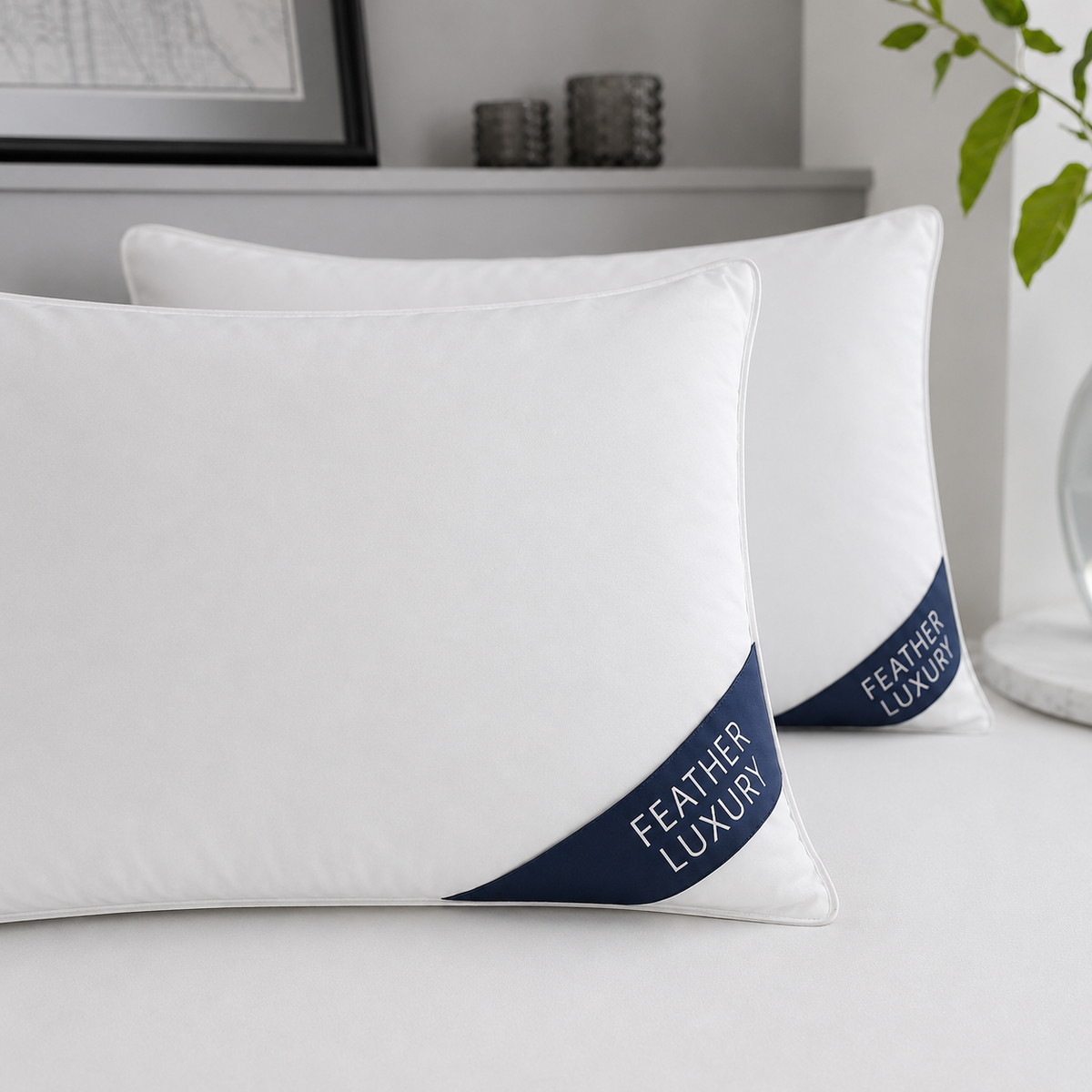 Duck feather pillow pair close detail with white piping and navy Feather Luxury badges