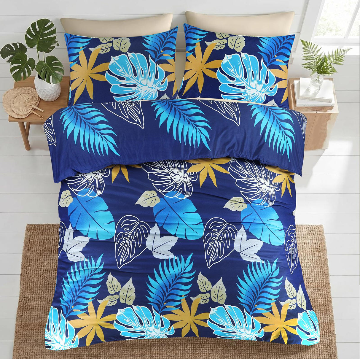 Indigo navy blue tropical leaf bedding overhead view