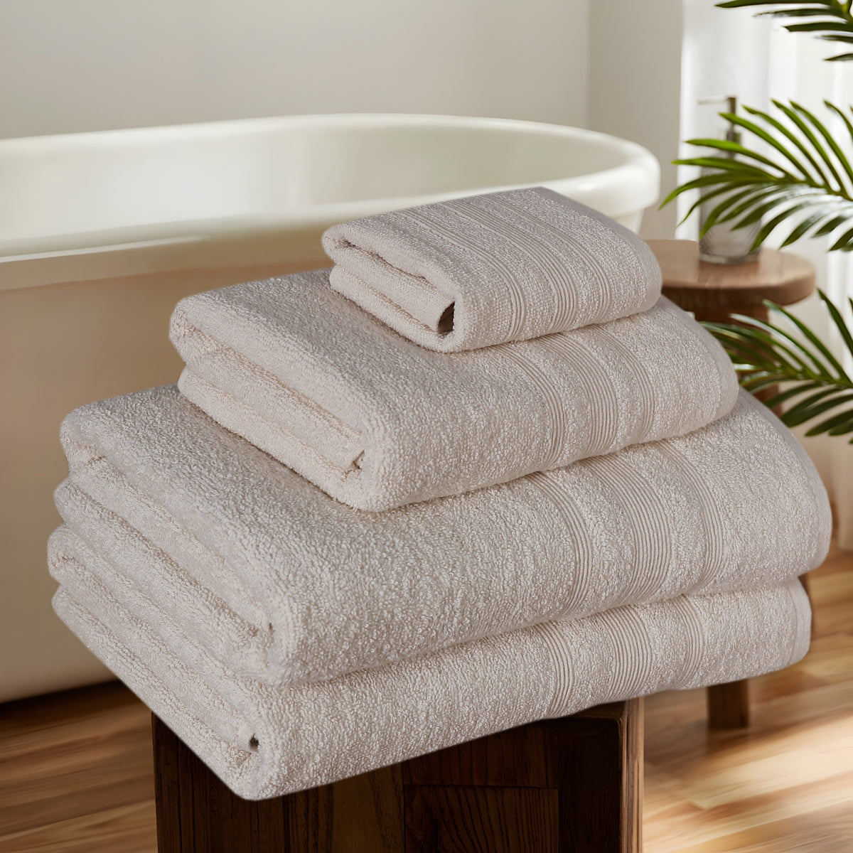 Cream cotton towels in bathroom setting
