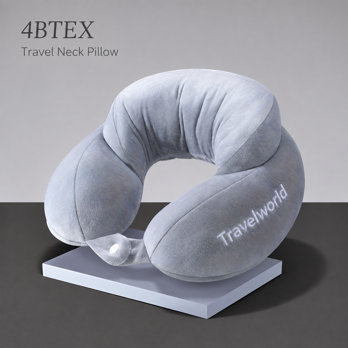 Silver Travelworld U-shaped neck pillow with raised back and front snap fastening — hero view