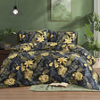 Aurelia black and gold tropical leaf duvet cover set on bed