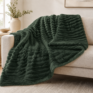 Dark Green chunky ribbed plush blanket throw on a sofa