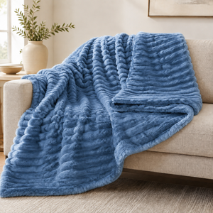 Denim Blue chunky ribbed plush blanket throw on a sofa