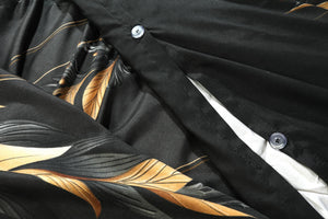 Ember black and gold duvet cover button closure close-up