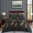Ember black and gold botanical duvet cover set on bed