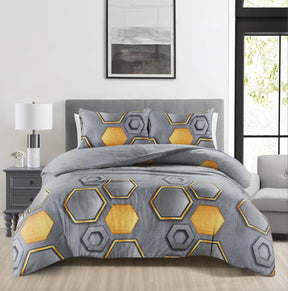 Holies grey and ochre hexagon duvet cover set on bed