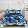 Indigo navy blue tropical leaf duvet cover set on bed