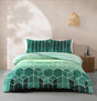 Vance emerald green geometric cube duvet cover set on bed